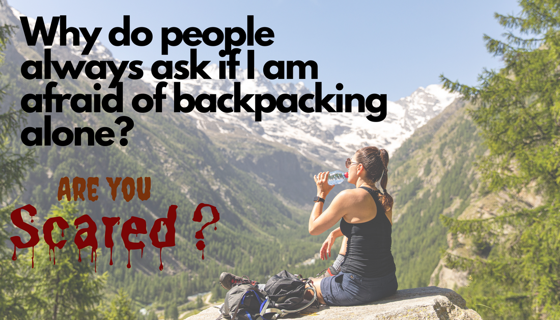 Image of a woman sitting on a rock in the mountains. Text blocks: Why do people always ask if I am afraid of backpacking alone?